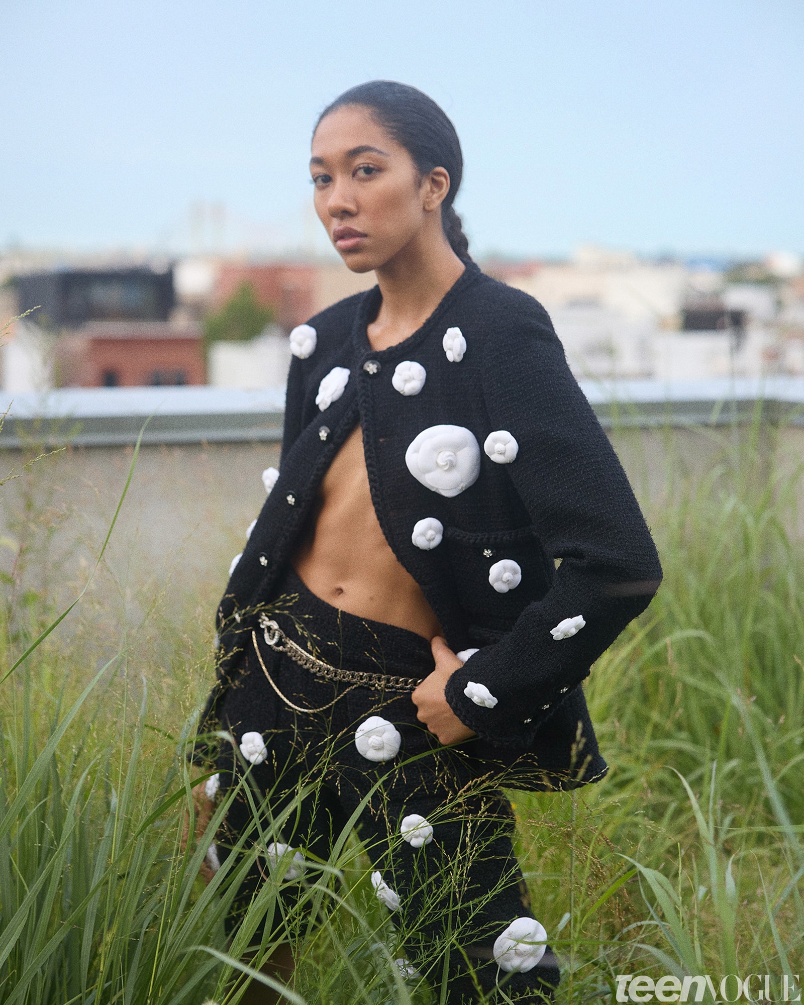 Aoki Lee Simmons wearing polka dots standing in grass