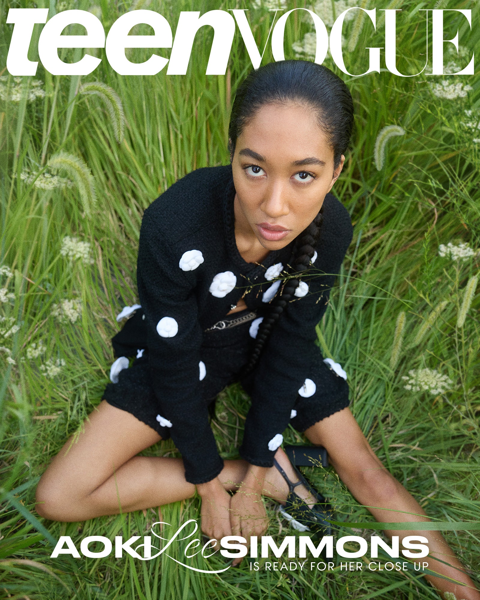 Aoki Lee Simmons wearing polka dots sitting in grass